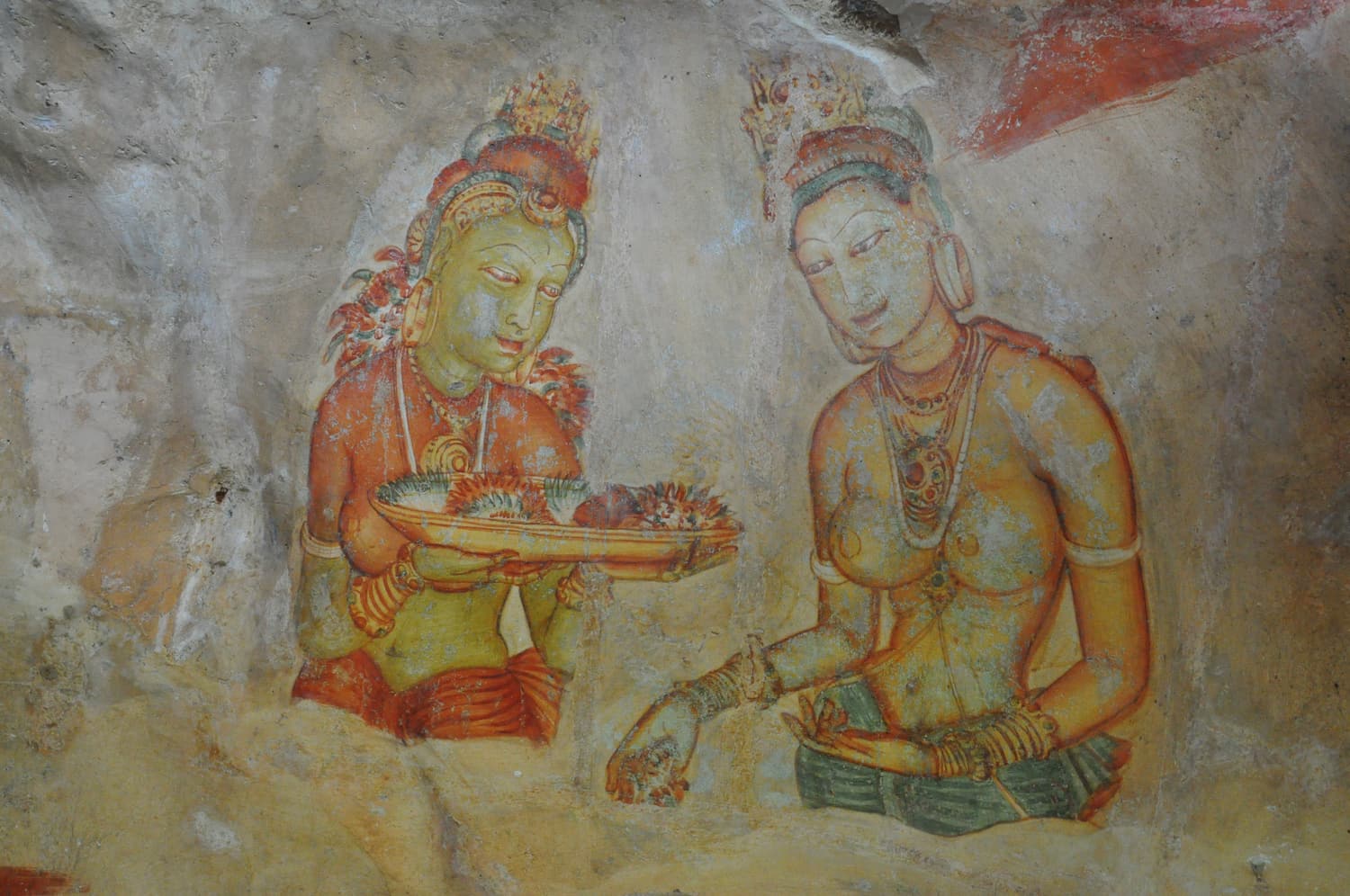 Fifth-century fresco of two celestial maidens painted on the rock face of Sigiriya